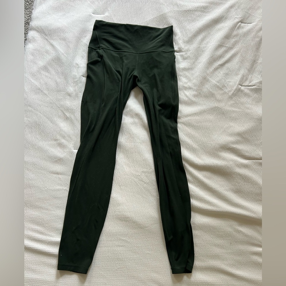 Lululemon dark green leggings size 8

Hi waisted 28 inseam
